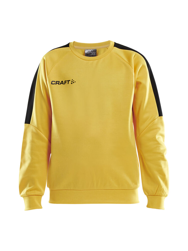 Progress R-Neck Sweater Jr från Craft i Sweden yellow/Svart