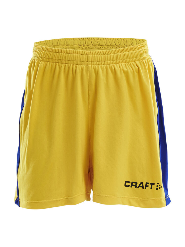 Progress Short Contrast Jr Wb från Craft i Sweden yellow/Club cobolt